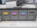 Color toners in the digital laser printer. (cyan, magenta, yellow, black) Royalty Free Stock Photo