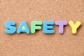 Color toy foam alphabet in word safety on cork board Royalty Free Stock Photo