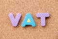 Color foam alphabet in word VAT Abberviation of Value added tax on cork board background Royalty Free Stock Photo