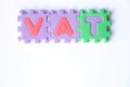 Toy foam alphabet in word VAT Abberviation of Value added tax on white background Royalty Free Stock Photo