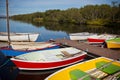 Color Wooden Boats with Paddles in a Lake Royalty Free Stock Photo