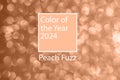 Color of the year 2024 background. Peach new trend color on red purple abstract blurred bokeh background.