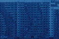 Color of the year 2020 classic blue. Facade of high-rise multi-storied residential buildings with loggias and windows. Beautiful