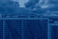 Color of the year 2020 classic blue. Facade of high-rise multi-storied residential buildings with loggias and windows. Beautiful