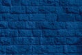 Color of the year 2020 classic blue. Stone brickwork texture of old ancient wall in sunny day. Modern luxury background for design Royalty Free Stock Photo