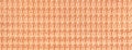 Color of the year 2024 peach fuzz. Light orange background from fabric closeup. Texture of coral textile backdrop Royalty Free Stock Photo