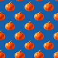 Seamless pattern with ripe orange pumpkin on trendy classic blue background Royalty Free Stock Photo