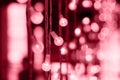 Color of the Year 2023 Viva Magenta color. Abstract blurred of pink glittering shine bulbs lights background. Christmas wallpaper Royalty Free Stock Photo