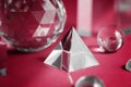 Color of the year 2023 Viva magenta. Crystal prism refracting light, magic crystals and pyramid, sphere and cube on Royalty Free Stock Photo