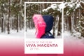 Color of the year 2023. Viva magenta tint. Portrait of little happy girl in pink warm hood walking outside on nature Royalty Free Stock Photo