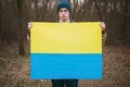 color yellow blue issue political Russia Ukraine crisis war idendity national flag ukrainain sign holds man Young