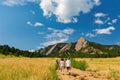 People hiking towards the famous Flatirons