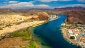 River winding through the desert alongside sand dunes Royalty Free Stock Photo