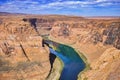 Colorado River Winding Through Rock Formations At Horsehoe Bend