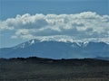 Colorado snow-capped mountains with overcast.