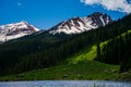 Colorado Spring Peaks Snow Tops Green Valley Pine Forest Royalty Free Stock Photo