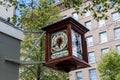 Clock with Roman numerals and Latin saying