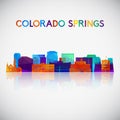 Colorado Springs skyline silhouette in colorful geometric style.