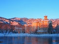 The historic Broadmoor Resort at dawn on a snowy day, Pike\'s Peak in the distance Royalty Free Stock Photo