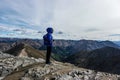 A woman hiker admires the summit view, Colorado Rocky Mountains Royalty Free Stock Photo