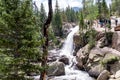 Tourists and hikers gather near Alberta Falls in Rocky Mountain National Park