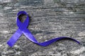 Colorectal/ Colon cancer, Cri du Chat and Acute Respiratory Distress Syndrome ARDS awareness with dark blue ribbon on old wood