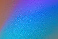 Colored abstract background from drops on glass. Rainbow color transitions
