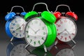 Colored alarm clocks, 3D rendering on dark backdrop Royalty Free Stock Photo