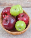 Colored Apples from garden in a basket on a table