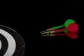 Colored arrows on a black background and target. Hit the target Royalty Free Stock Photo