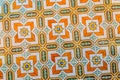 Colored azulejo ceramic tiles in yellow, orange and green