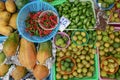 Colored background with fruits, green and red chili