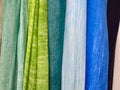 Colored background. hanging scarves of various colors Royalty Free Stock Photo