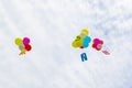 Colored balloons with Bulgarian letters in the clouds