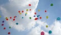 colored balloons fly into the sky with clouds during the party Royalty Free Stock Photo