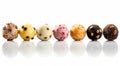 Colored balls of ice cream with nuts and chocolate chips in row Royalty Free Stock Photo