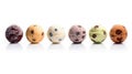 Colored balls of ice cream with nuts and chocolate chips in row Royalty Free Stock Photo