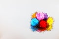 Colored beautiful pompons on a gray background Royalty Free Stock Photo