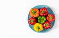 Colored bell peppers on white background. Green, yellow, orange and red pepper. Food concept Royalty Free Stock Photo