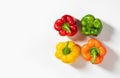 Colored bell peppers on white background. Green, yellow, orange and red pepper. Food concept Royalty Free Stock Photo