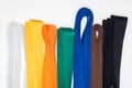 Colored belts in martial arts, and a part of judo uniform Royalty Free Stock Photo