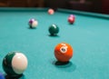 Colored billiard balls on a pool table Royalty Free Stock Photo
