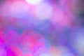 Colored blurry round spots of cool shades for pale mauve background