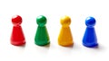 Colored board game pieces isolated on white Royalty Free Stock Photo