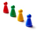 Colored board game pieces isolated on white Royalty Free Stock Photo