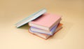 Colored books on a beige background