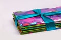 Colored books in a stack. Children`s books in a gift ribbon.