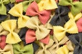 Colored bow tie pasta. Closeup multiple farfalle