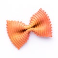 Colored bow tie pasta. Closeup single orange farfalle on white background Royalty Free Stock Photo