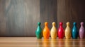 Colored bowling pins in a row on wooden floor Royalty Free Stock Photo